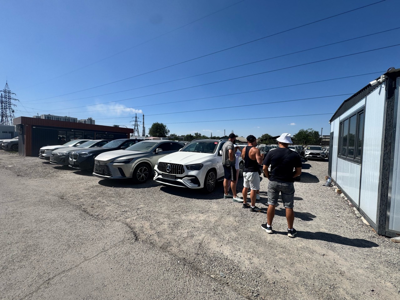 Customers viewing vehicles at the Bishkek yard