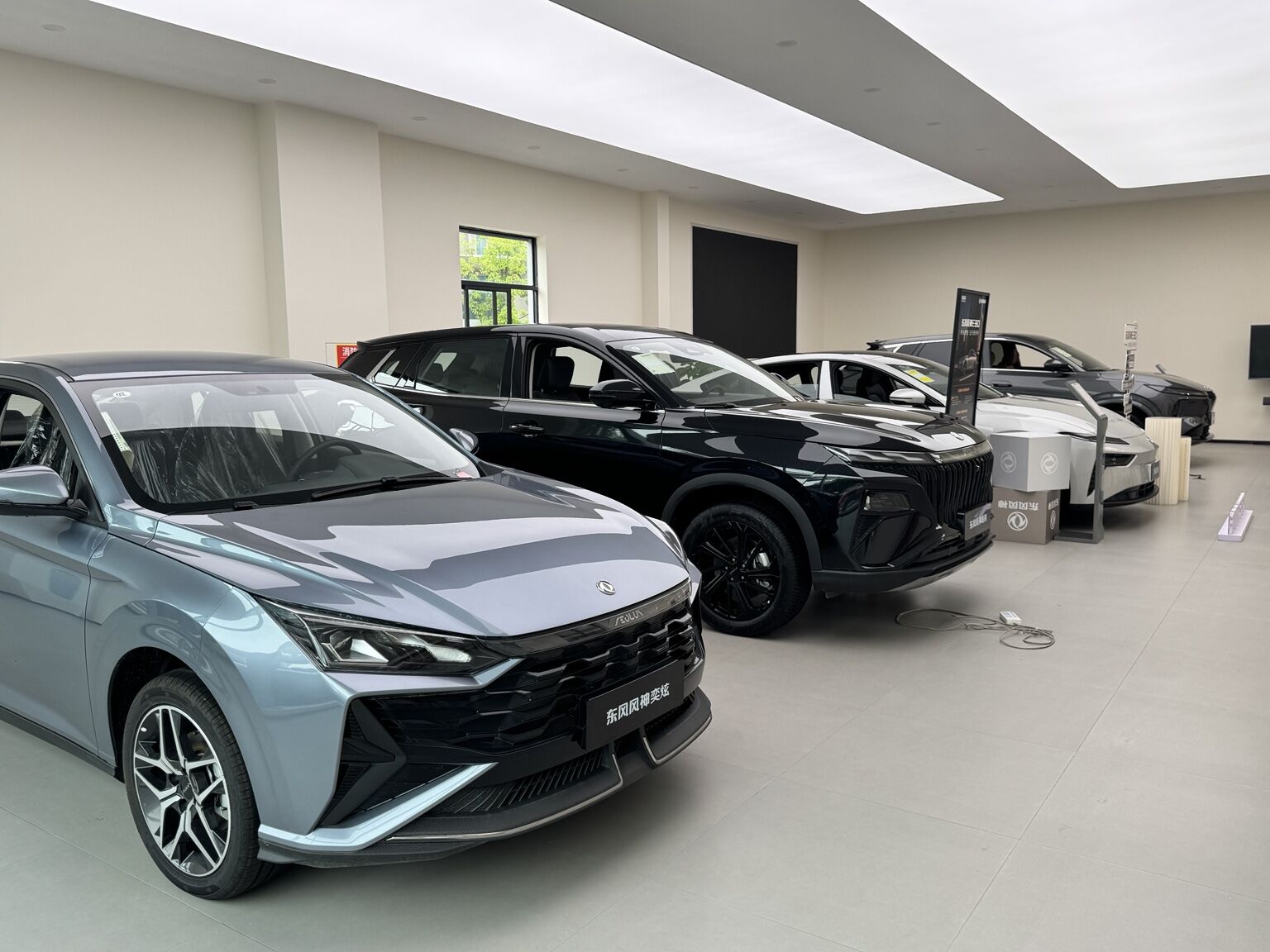 Dongfeng Fengshen vehicle lineup inside the Hangzhou showroom
